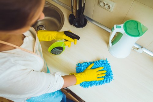 Technician treating a fabric stain on a couch