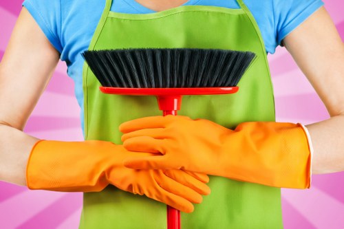 Employee wearing PPE including helmet and high-visibility clothing