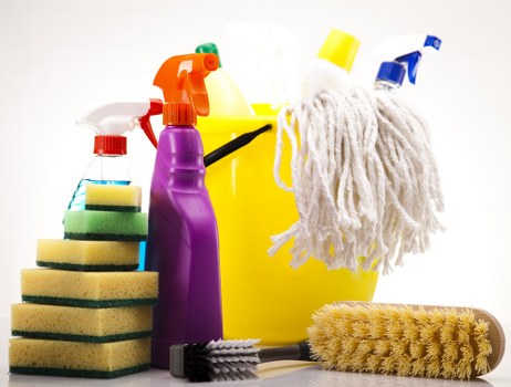 Vacuuming a couch as part of regular sofa maintenance