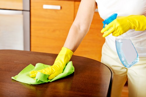 Technician treating stains during commercial carpet cleaning
